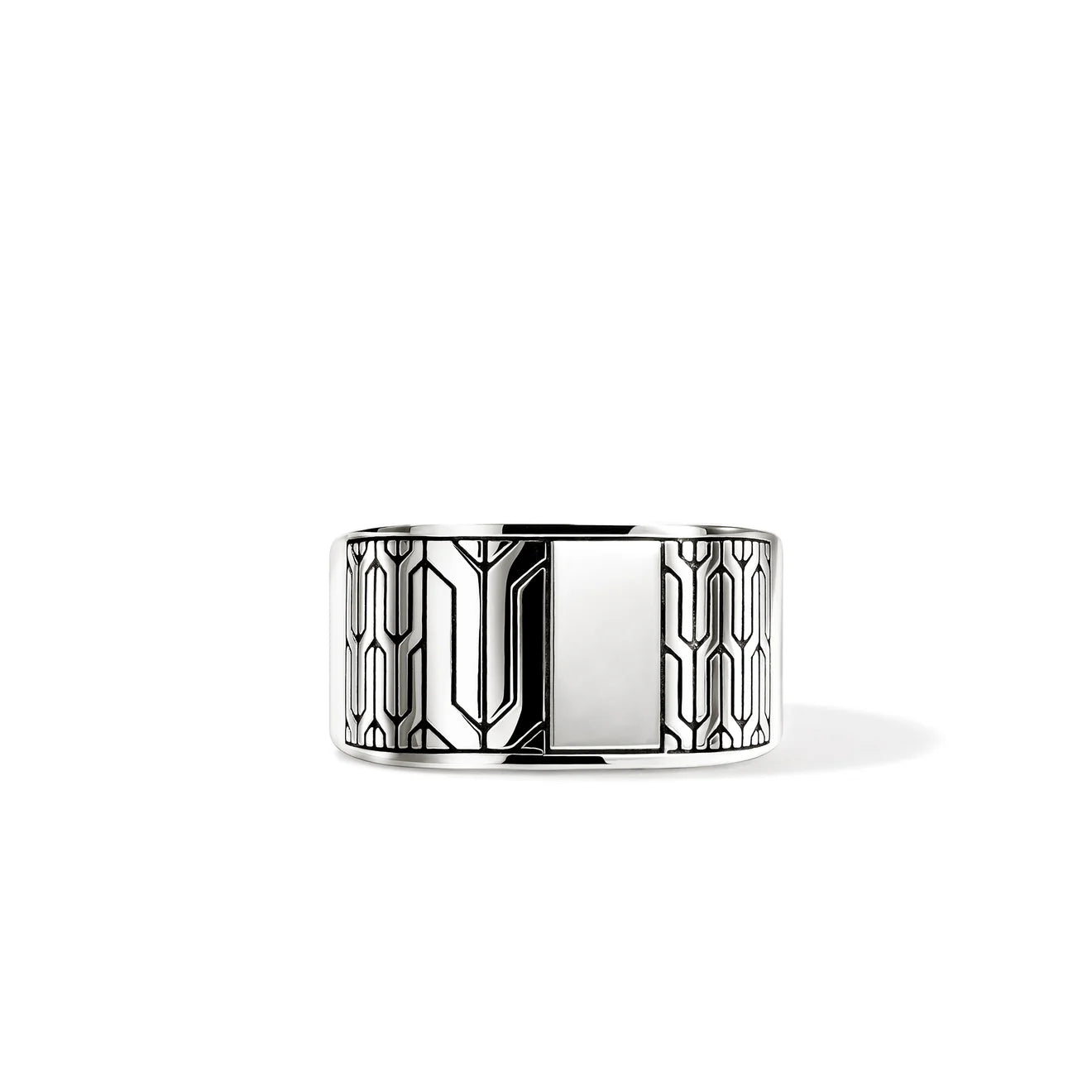 Silver ring with geometric design on a white background