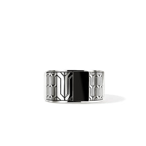A wide silver-toned cuff ring with a bold black center panel and geometric line patterns on the outer sides, shown on a clean white background.