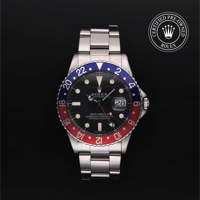 Rolex certified pre-owned GMT Master on a black background