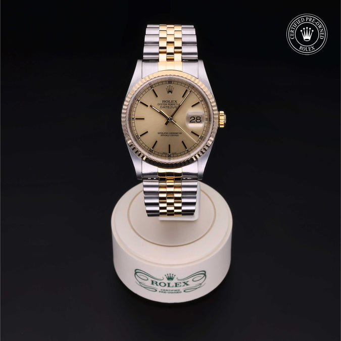 Rolex watch on a display stand with a dark background