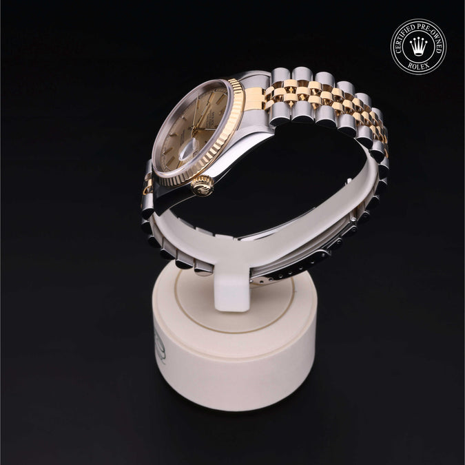 Luxury watch on a display stand with a dark background