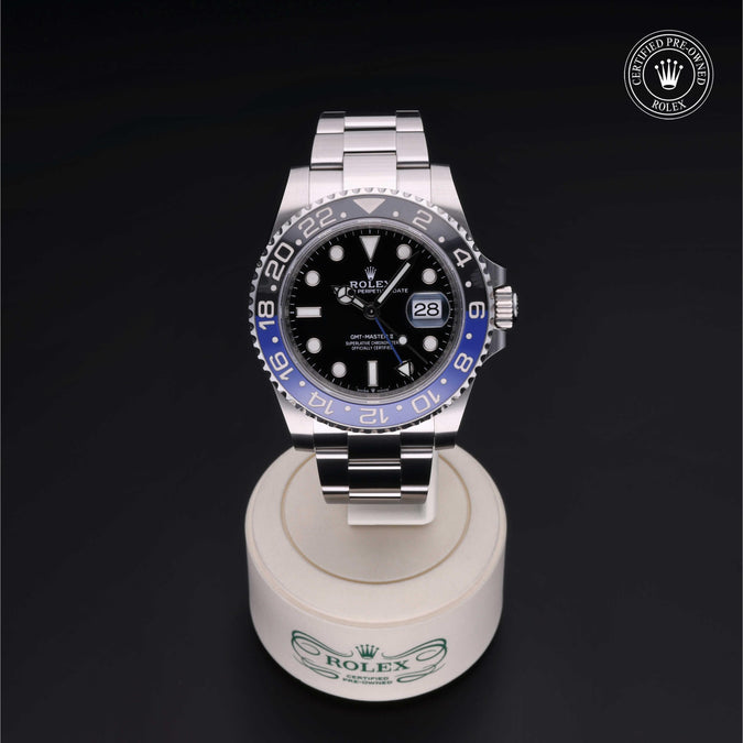Front of Rolex GMT-Master II showing black dial, blue-and-black ceramic 24-hour bezel and steel Oyster bracelet on dark background
