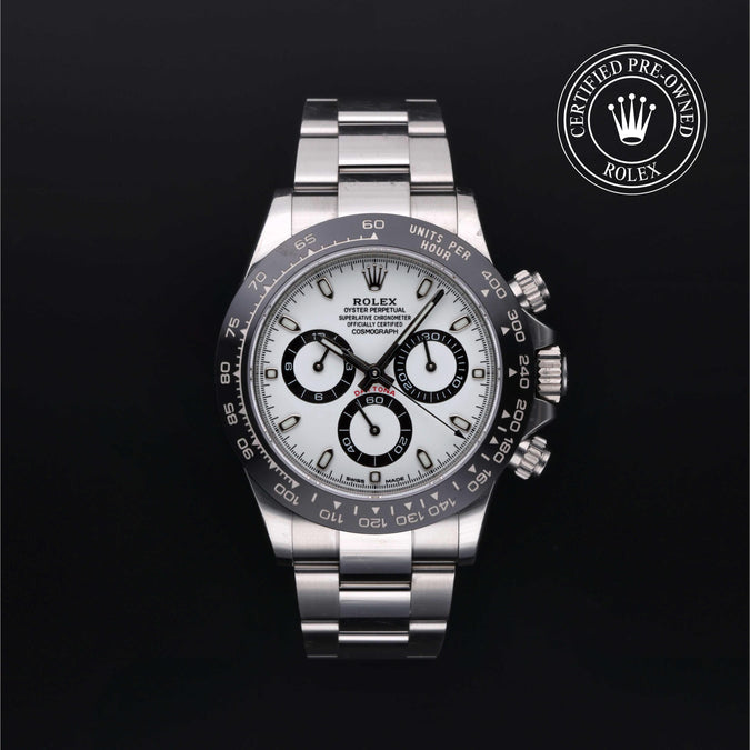 Silver Rolex with certified pre-owned logo with white dial and black markings on a black background