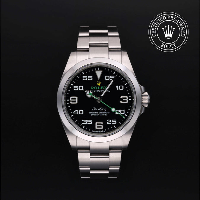 Silver Rolex watch with black dial on a dark background, featuring a Certified Pre-Owned Rolex logo.