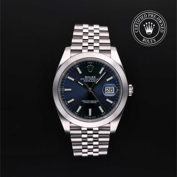 Silver Rolex watch with blue dial on a black background, featuring the 'Certified Pre-Owned Rolex' logo.