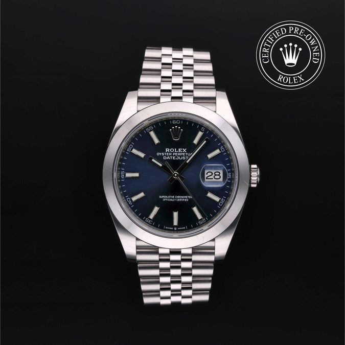 Silver Rolex watch with blue dial on a black background, featuring the 'Certified Pre-Owned Rolex' logo.