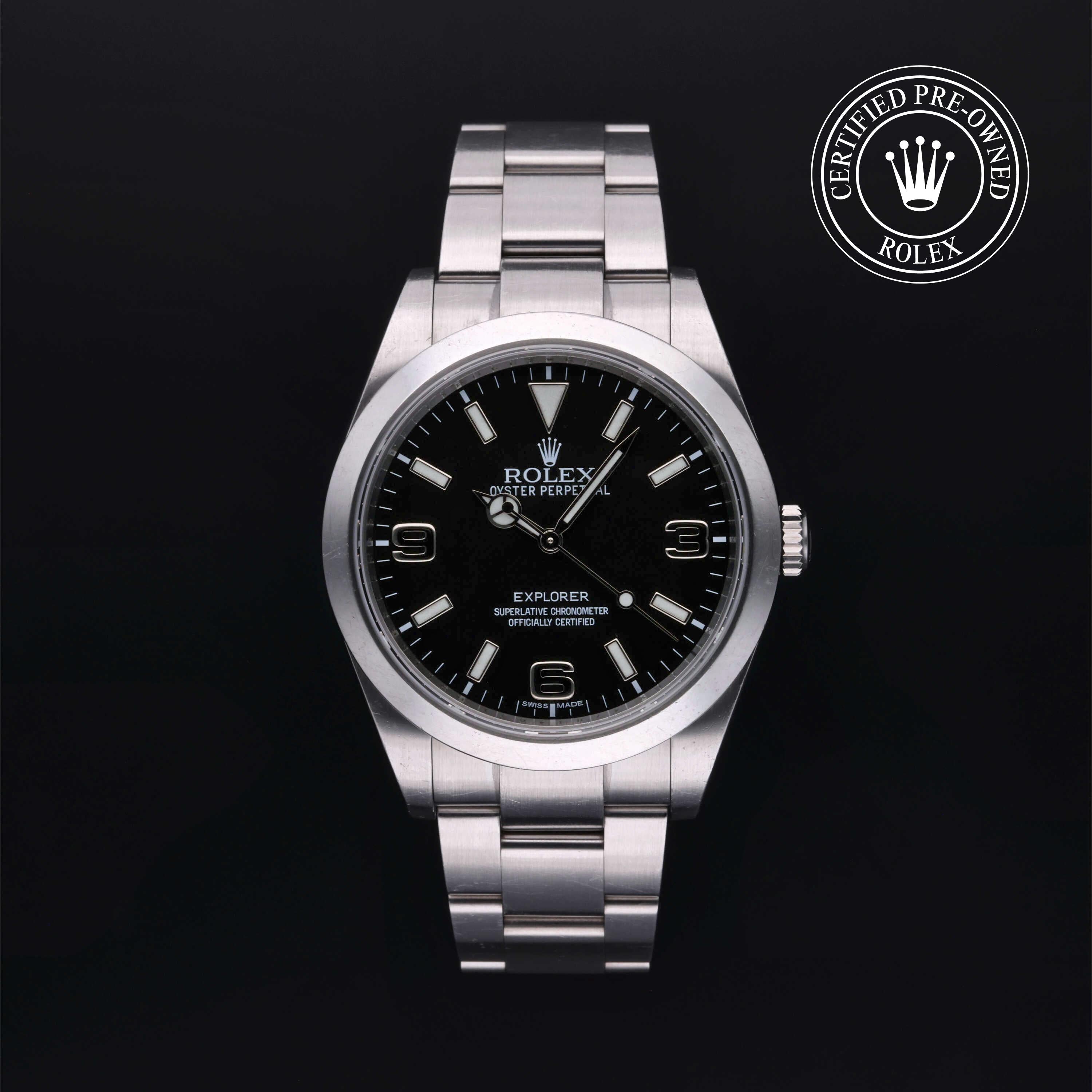 Rolex watch with black dial on a dark background, featuring the Rolex logo.
