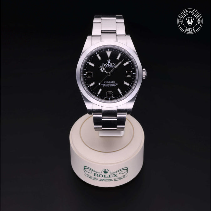 Rolex watch on a display stand with a dark background