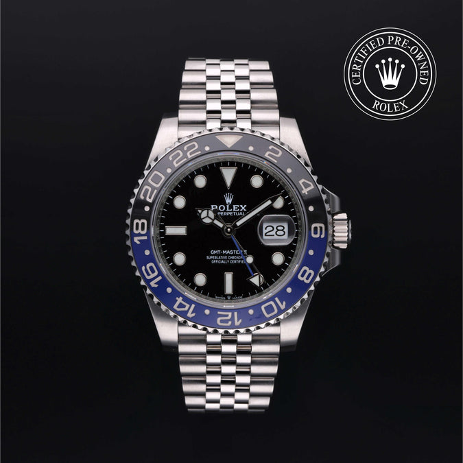 Front of GMT-Master II with black dial, blue-and-black 24-hour bezel, magnified date and Jubilee steel bracelet on black