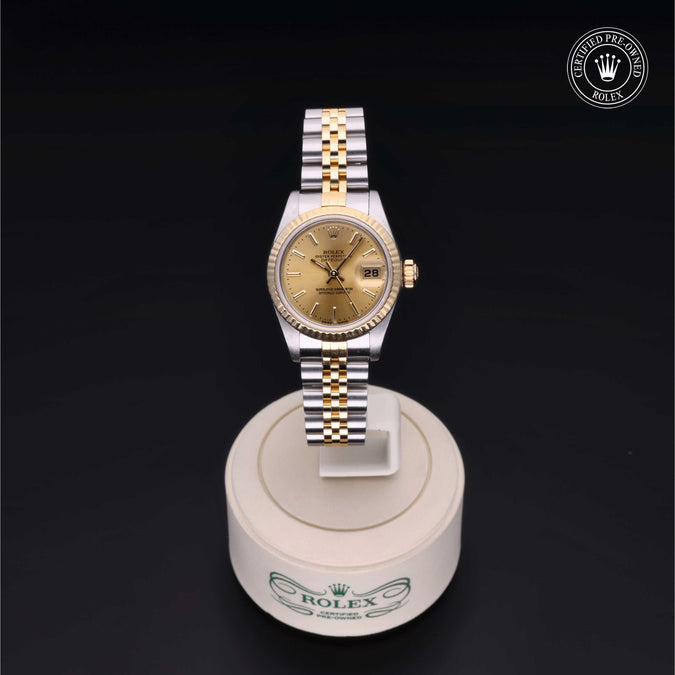Rolex watch on a display stand with a black background