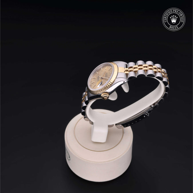 Luxury watch on a display stand with a dark background