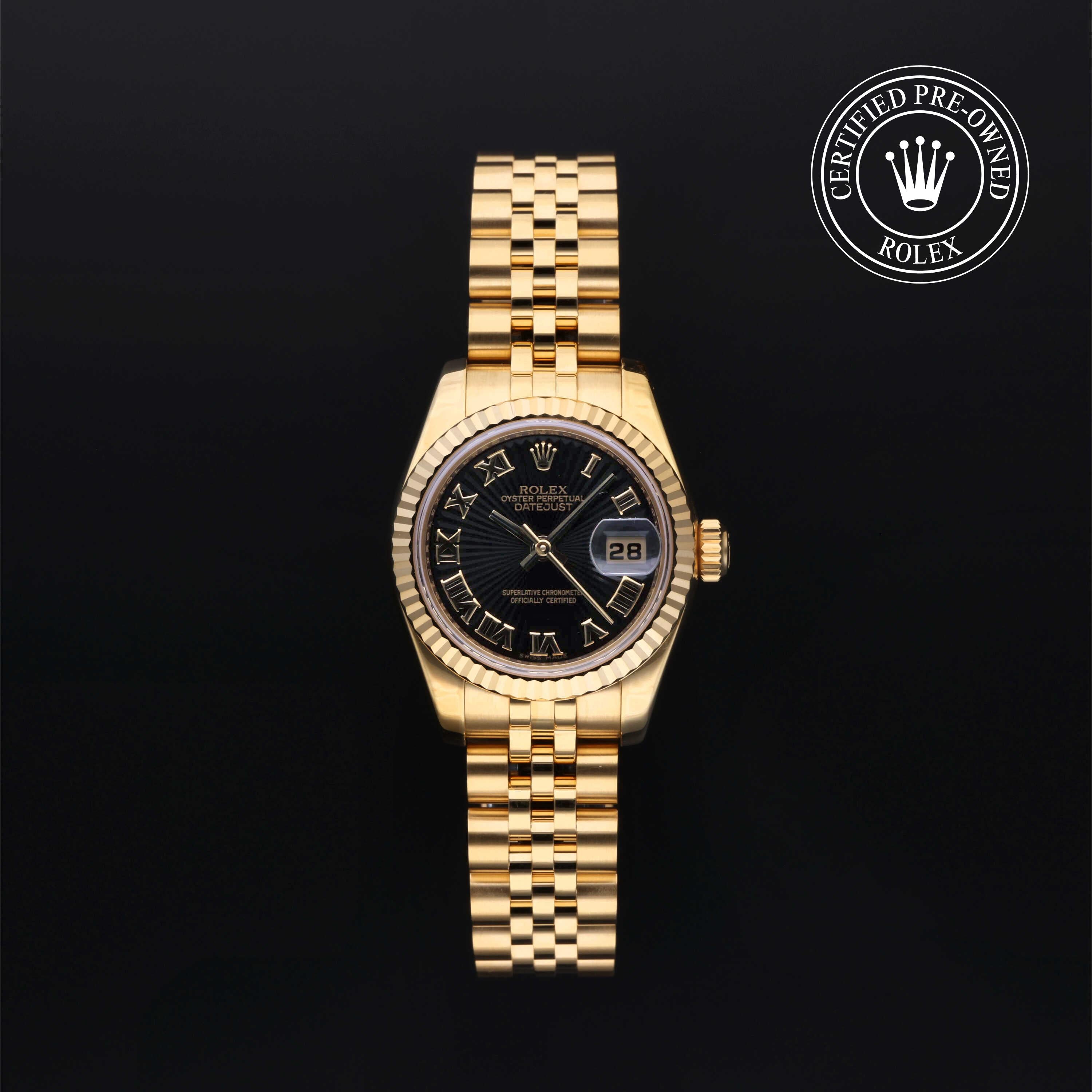 Front of Rolex Lady-Datejust 26 18k yellow gold watch with black dial, fluted bezel; Certified Pre-Owned emblem