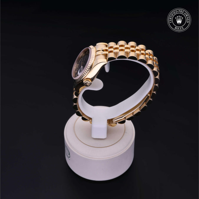 Luxury watch on a display stand with a dark background