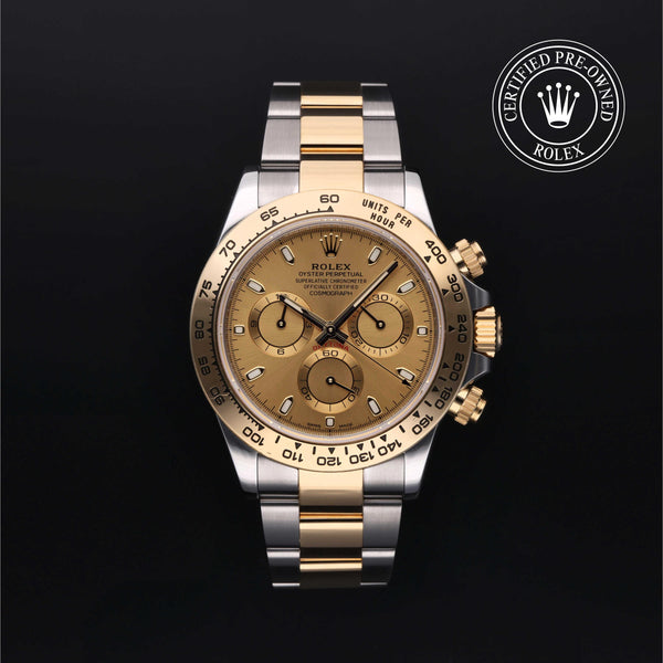 A Rolex Cosmograph Daytona wristwatch with a two-tone stainless steel and yellow gold bracelet, featuring a champagne-gold dial and a black tachymeter bezel. A 'Certified Pre-Owned Rolex' badge is visible in the top right corner against a solid black background.