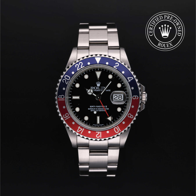 Stainless steel Rolex GMT-Master II with red and blue bezel and black dial on a black background with Rolex certified pre-owned logo at the top