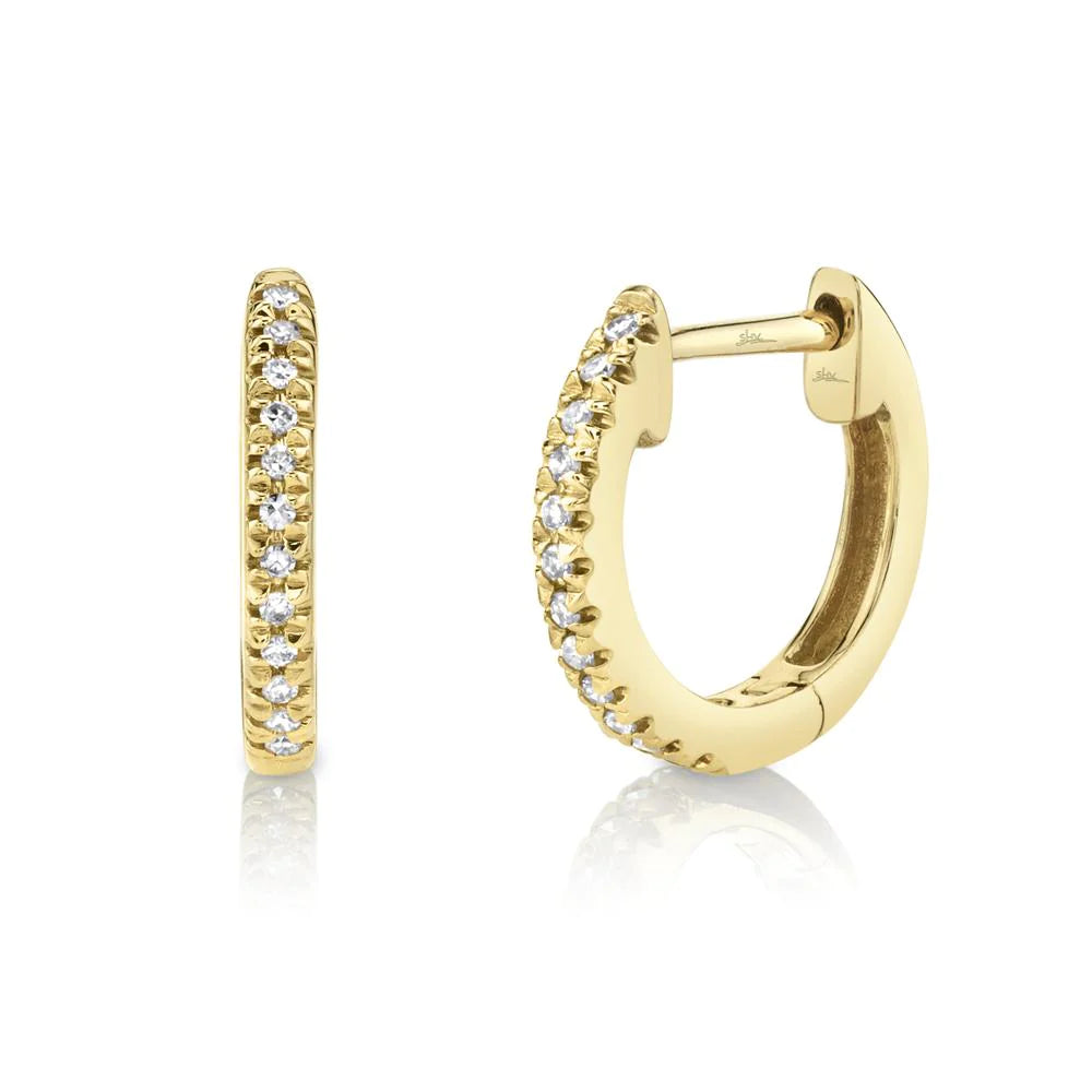 Yellow gold hoop earrings with pavé-set round diamonds; one shown front, one showing hinged back.