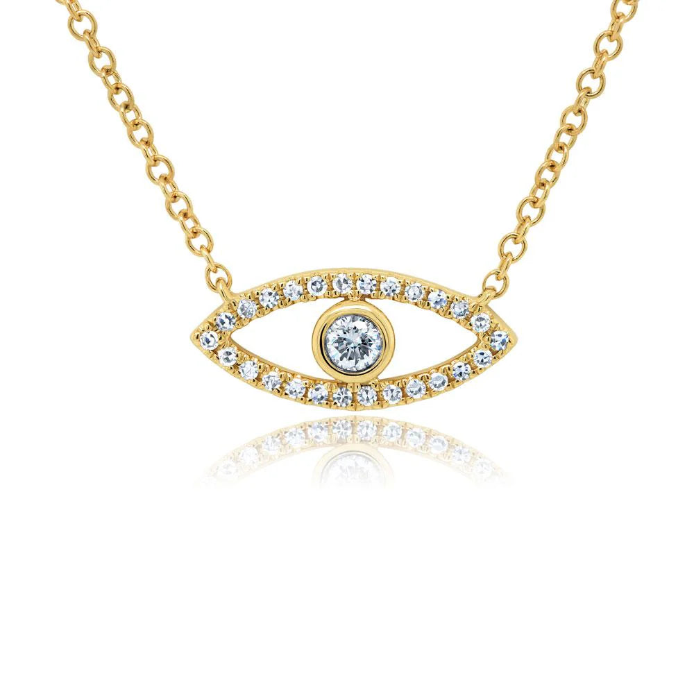 Gold evil-eye necklace pendant with central round clear stone and pavé crystals on a delicate chain, with reflection.