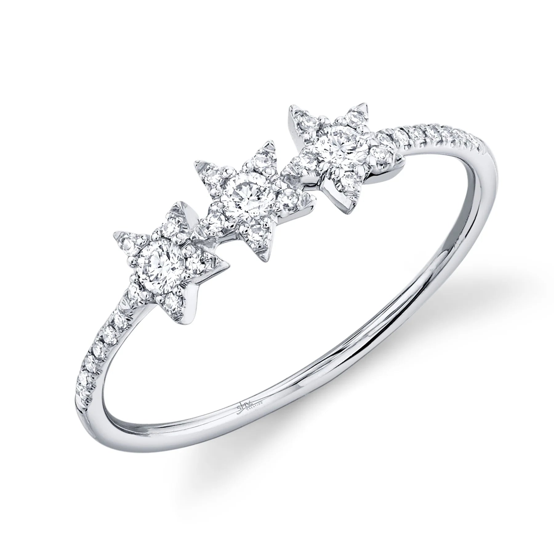 White gold ring with three star-shaped diamond clusters and pavé diamonds along the band.