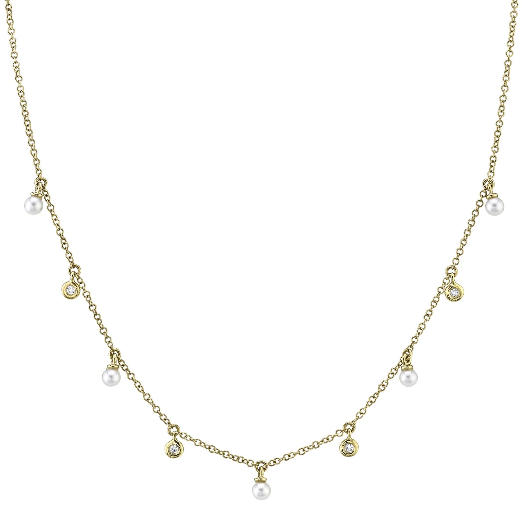 14k yellow gold station necklace with small dangling pearls and bezel-set round diamonds on a fine chain