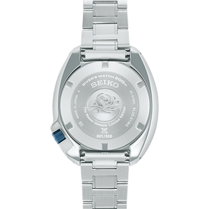 Silver Seiko watch with detailed caseback on a white background