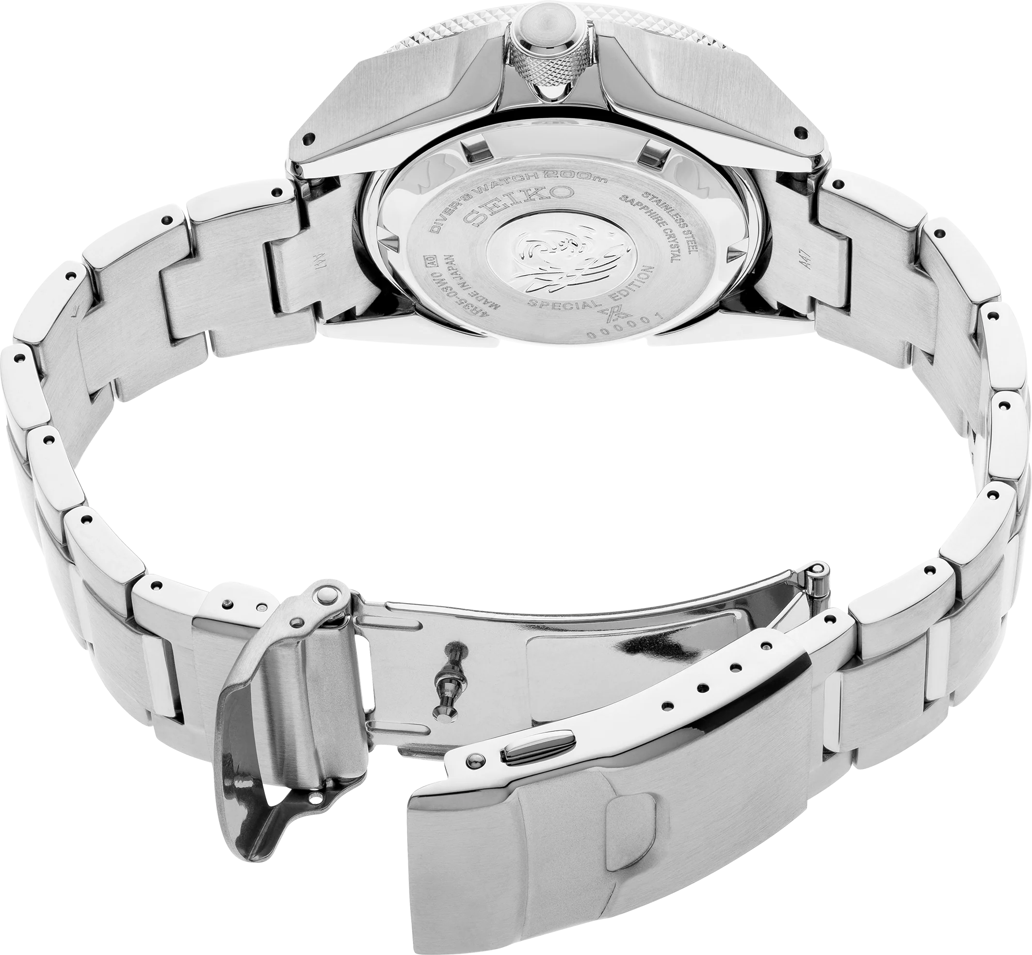 Close-up of a silver watch with a detailed back cover on a white background
