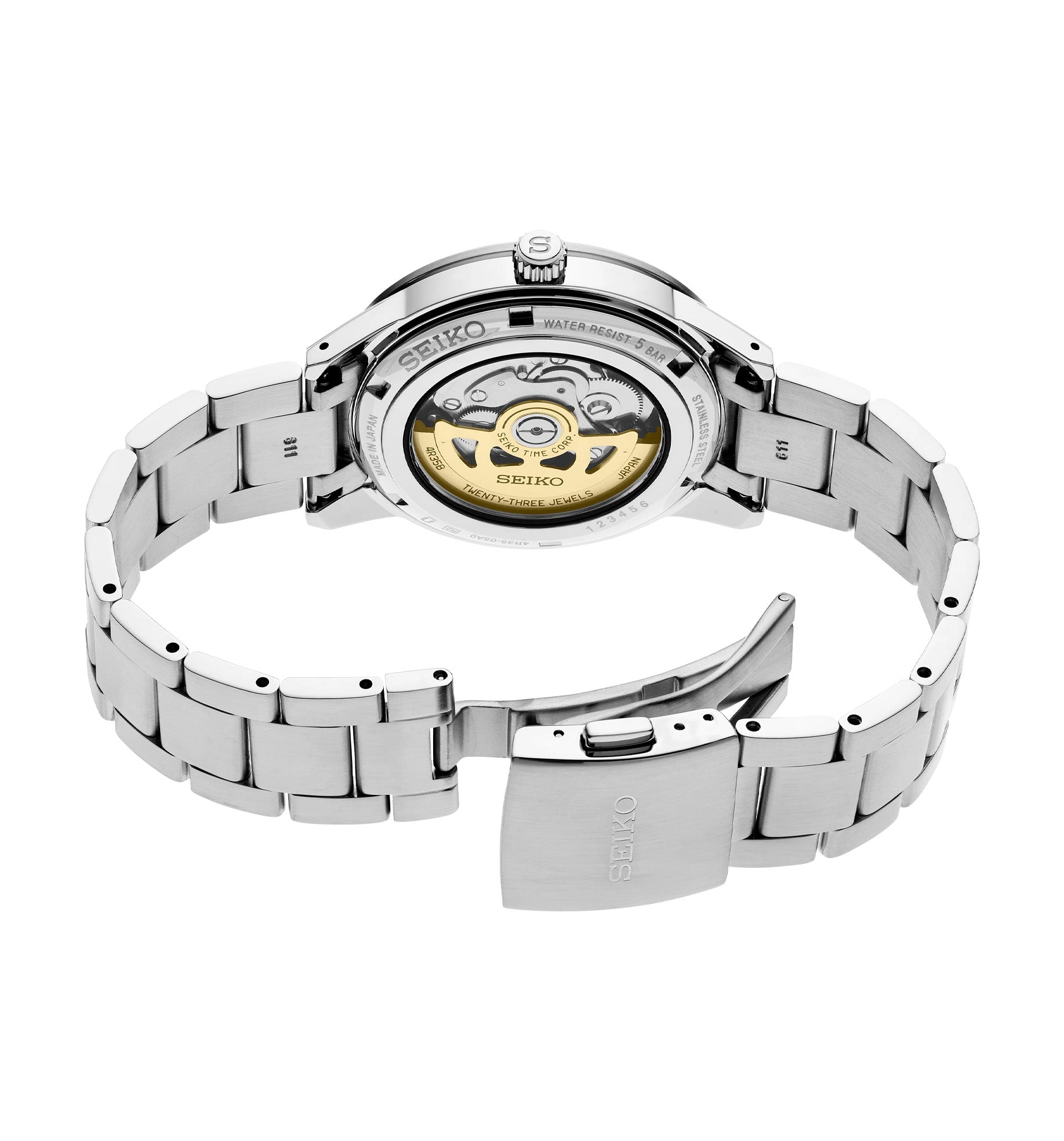 Rear view of Seiko SRPG03 Presage Style '60s watch showing see-through caseback and stainless steel bracelet on white background