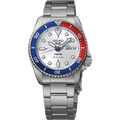 Front close-up of Seiko SRPL99 watch with Pepsi red-and-blue bezel, silver dial, day and date window and metal bracelet