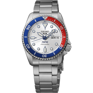 Front close-up of Seiko SRPL99 watch with Pepsi red-and-blue bezel, silver dial, day and date window and metal bracelet