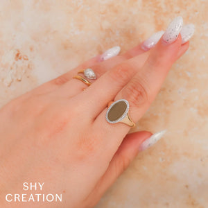 0.11ctw Diamond Oval Ring
