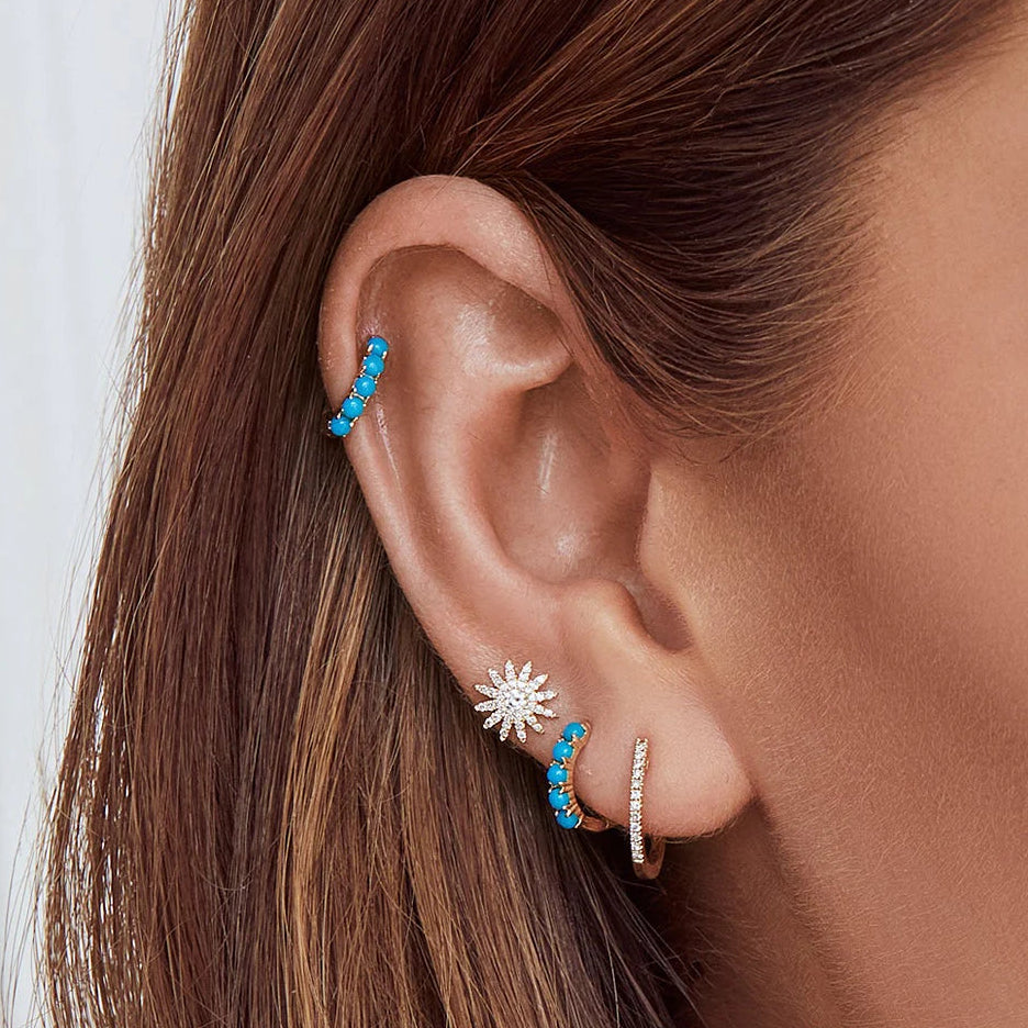 0.24ctw Diamond Starburst Stud Earring