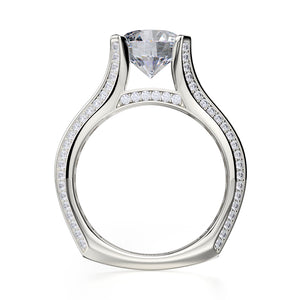 Front view of 18K white gold Strada engagement ring with round center diamond in cathedral setting and pave shoulders
