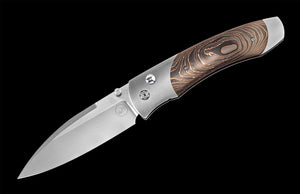 An open folding knife with wooden handle on a black background