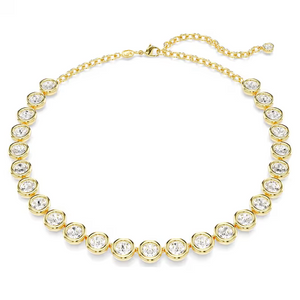 Flat-lay of Imber Tennis Necklace showing gold-tone bezel-set round crystals on white background