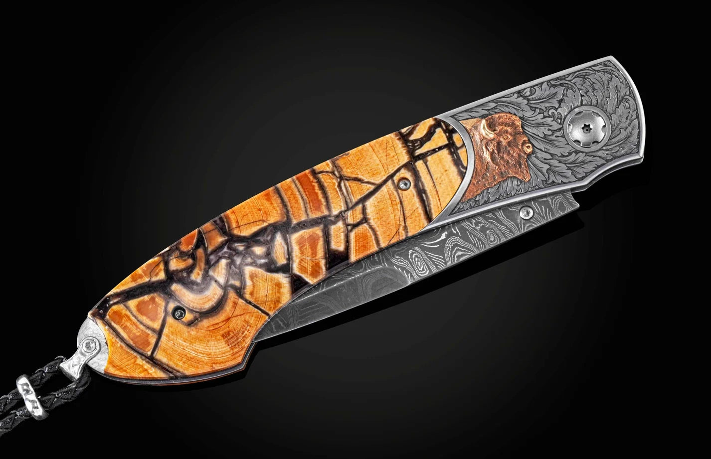 A folding pocket knife with a highly detailed Damascus steel blade and a decorative handle featuring orange, brown, and black inlay patterns, set against a dark background.