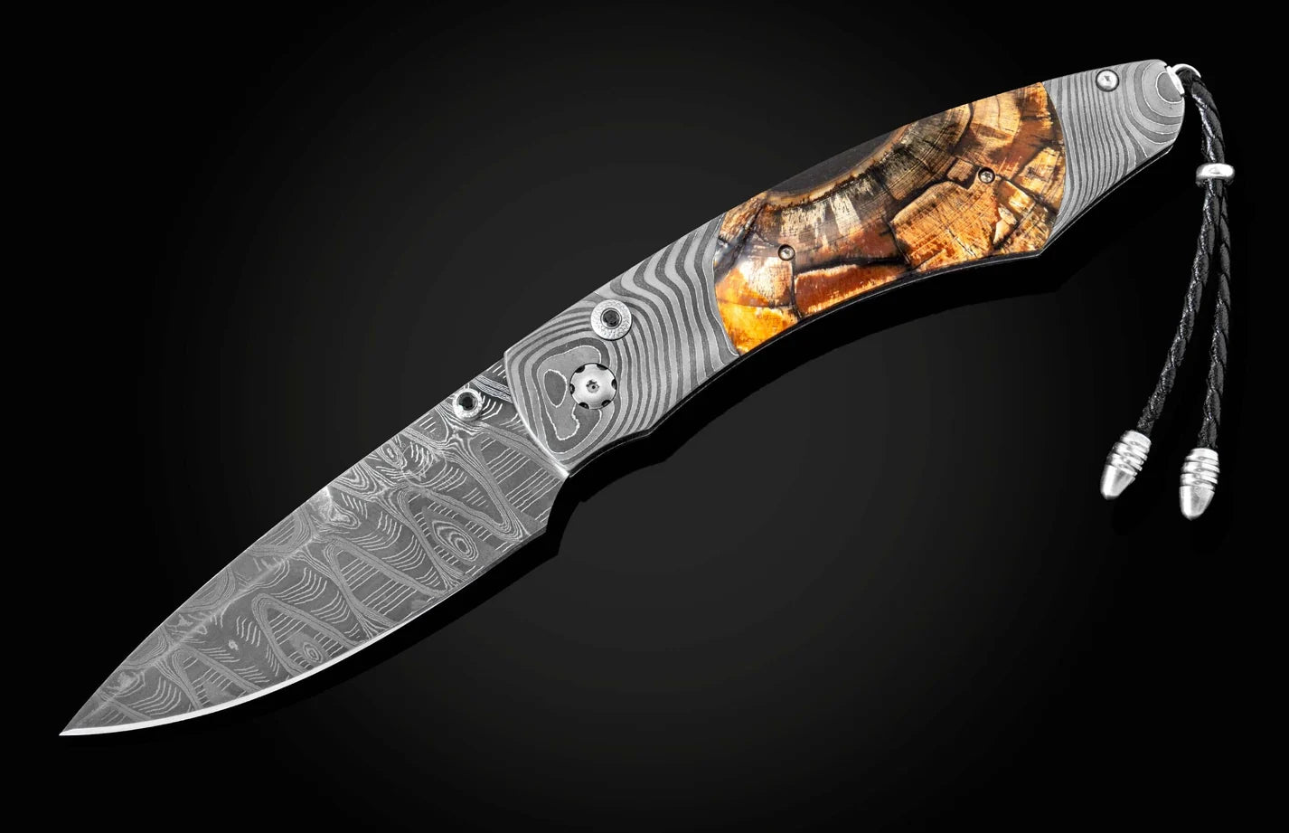 Forked blade knife with decorative handle on a black background