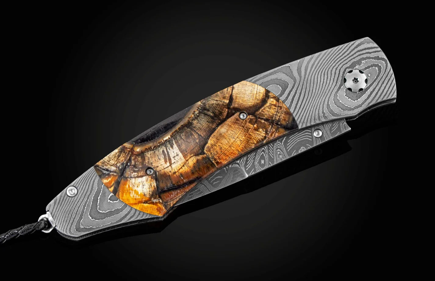 Folding knife with a camouflage handle on a black background