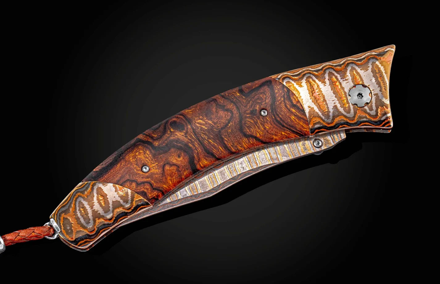 Decorative knife with a wooden handle on a black background