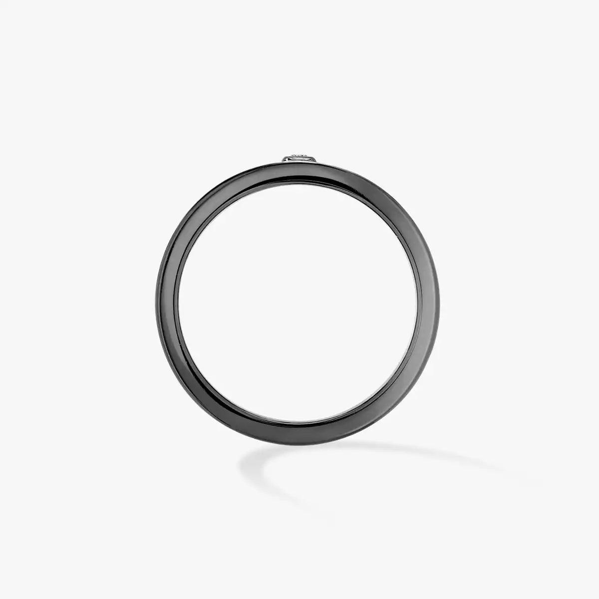 Black circular metal ring on a white background
