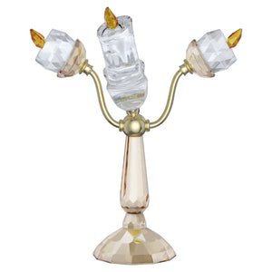 Back of Lumière candle with gold tone finishes with clear and champagne colored crystals on a white background