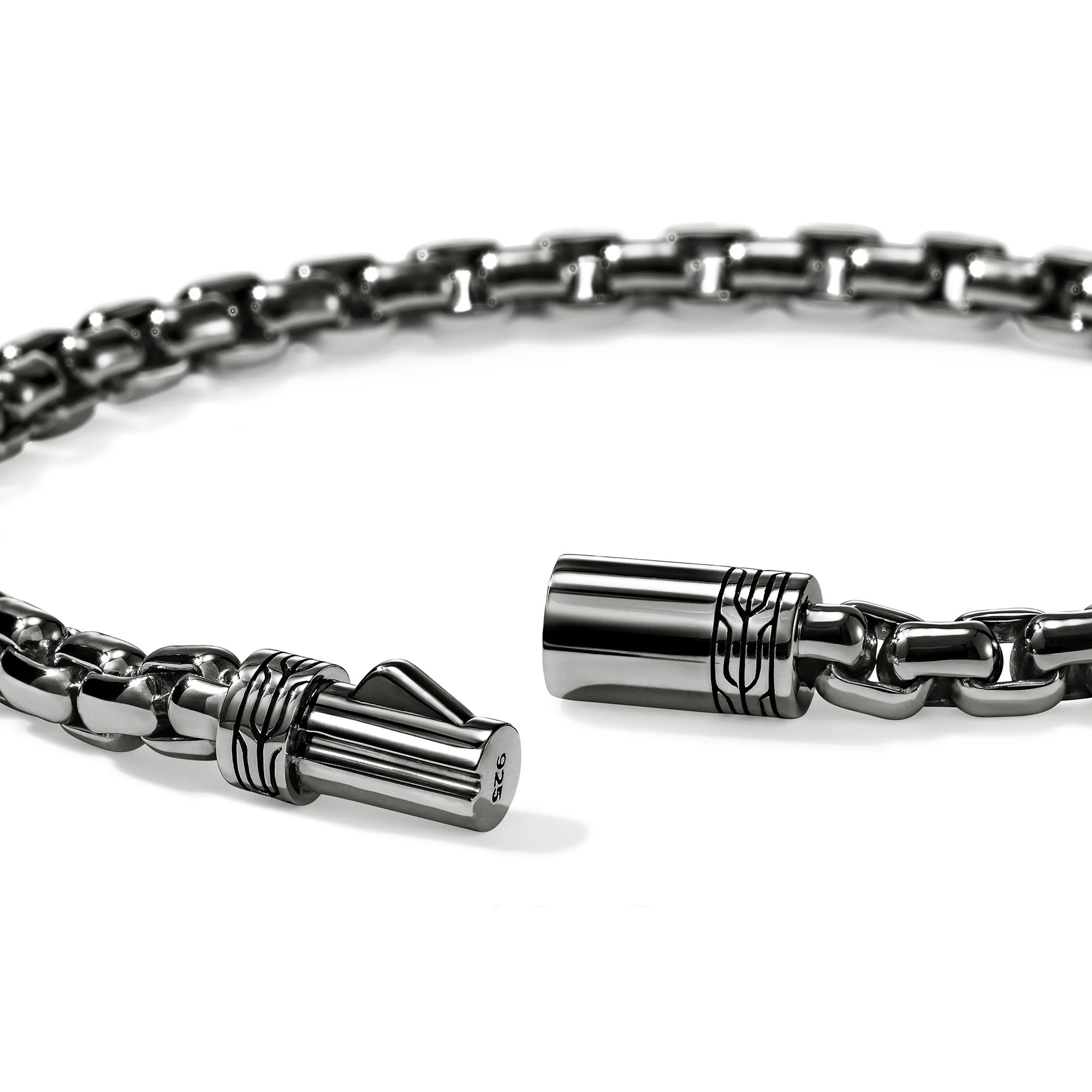 Close-up of dark sterling silver 3.7 mm box chain bracelet showing pusher clasp and link detail on white background