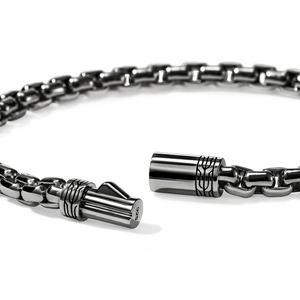 Close-up of dark sterling silver 3.7 mm box chain bracelet showing pusher clasp and link detail on white background