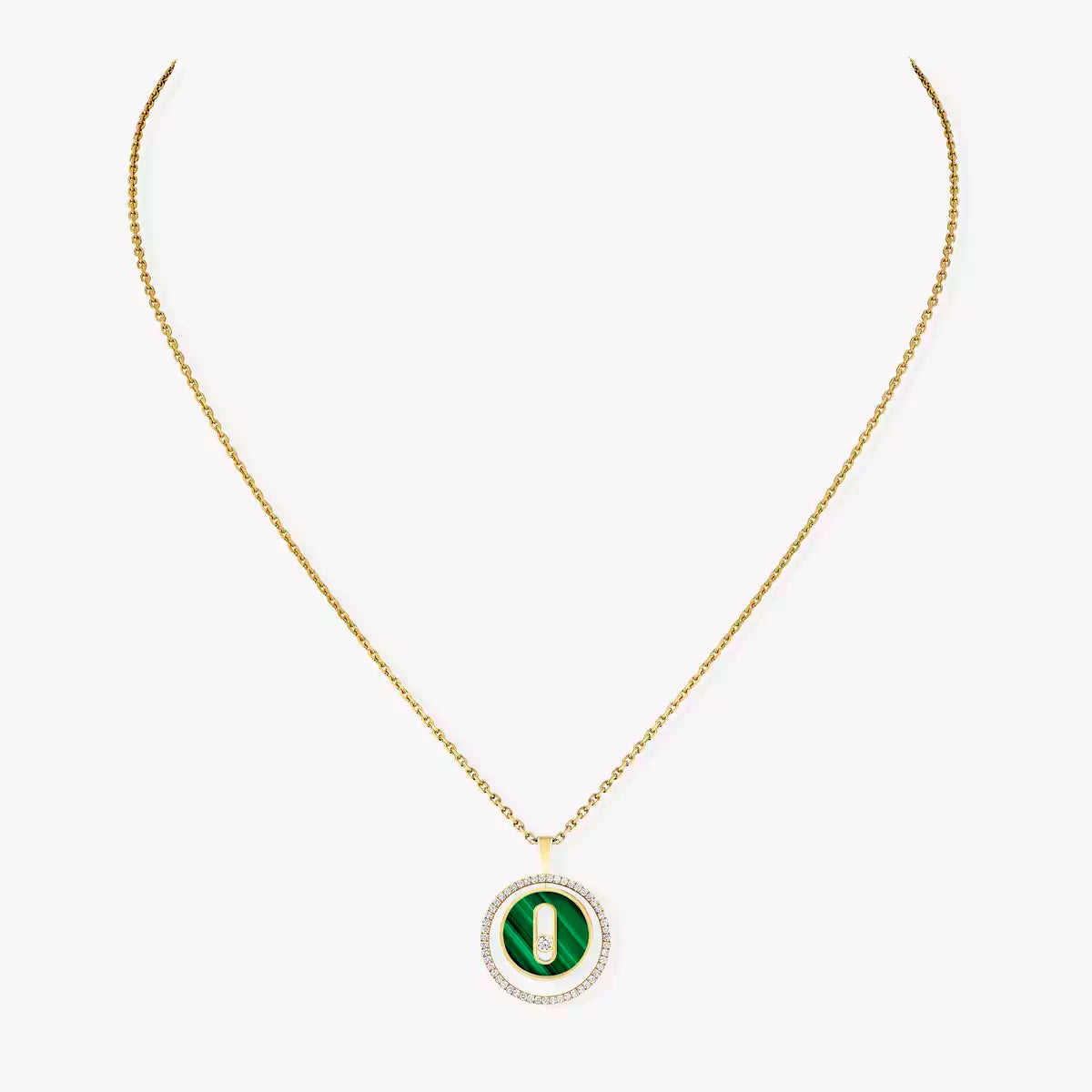 Gold necklace with a green pendant on a white background