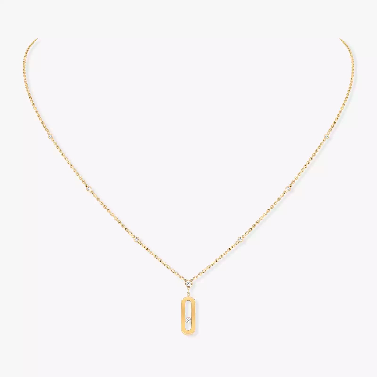Gold necklace with a rectangular pendant on a white background