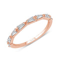 Rose-gold slim band set with tapered baguette diamonds spaced along the top.