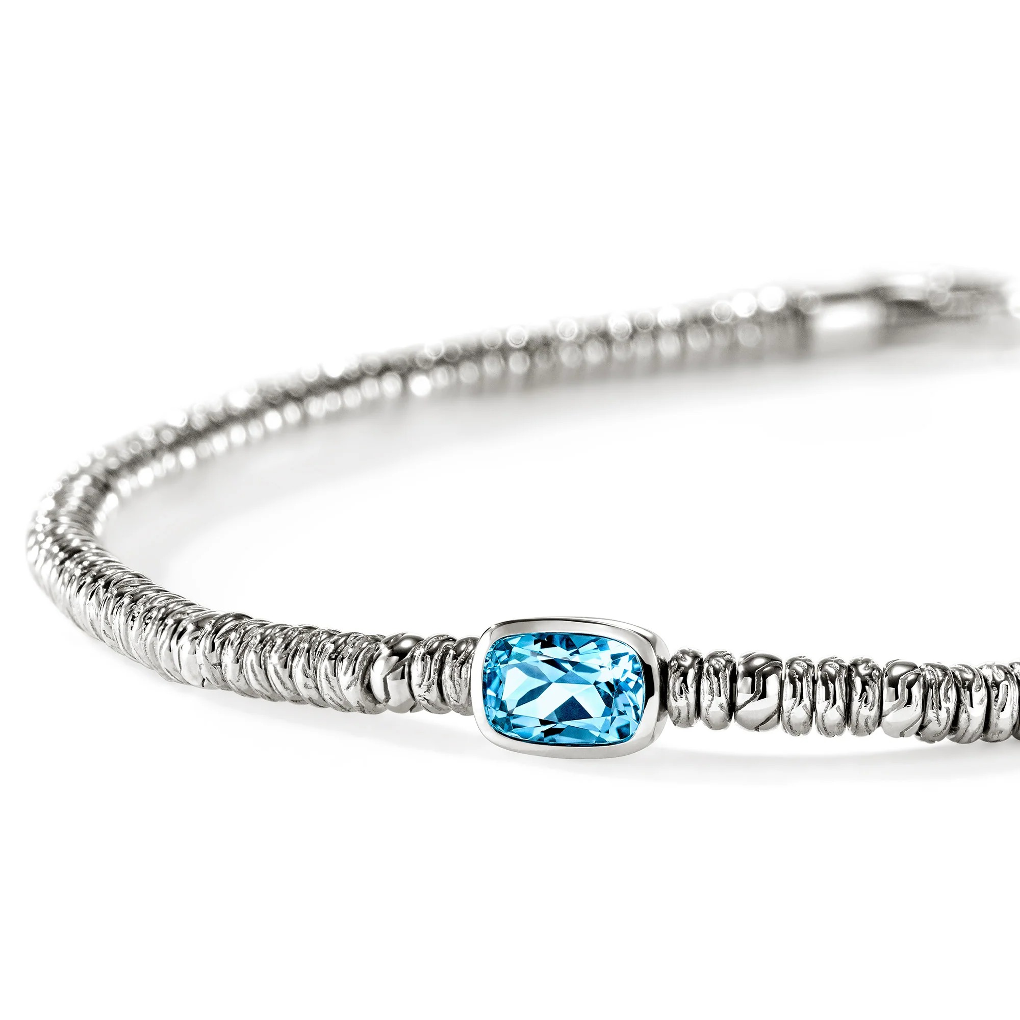 A silver-toned beaded bracelet featuring a central rectangular light blue gemstone, photographed on a clean white background.