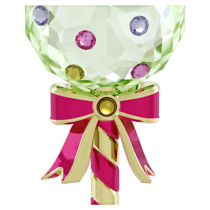 up close view of a green lollipop ornament with yellow and red stripe stick with red bow
