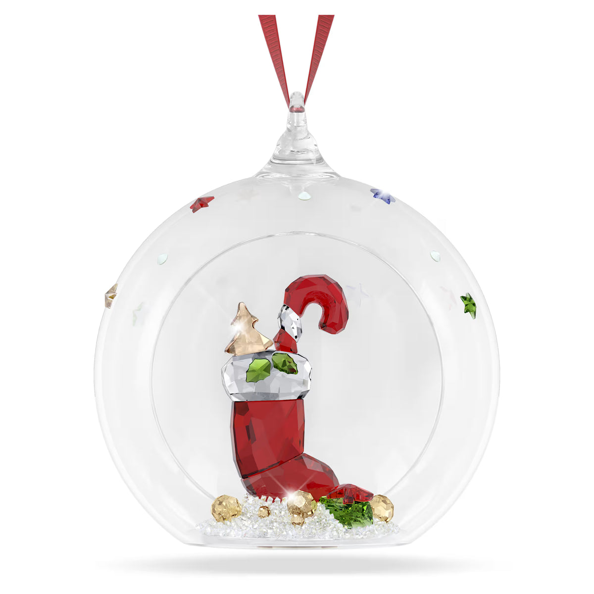 ball ornament with red ribbon and a red stocking stuffed with candy