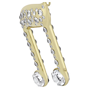 upclose side view of a gold tone with crystal music note with white ribbon on a white background