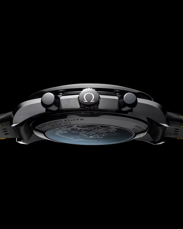 Side profile of Speedmaster Dark Side of the Moon 44.25mm showing Omega crown and display back on black