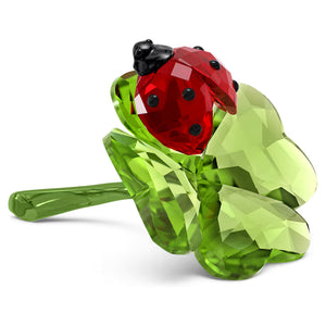 green crystal clover with red crystal lady bug on a white background